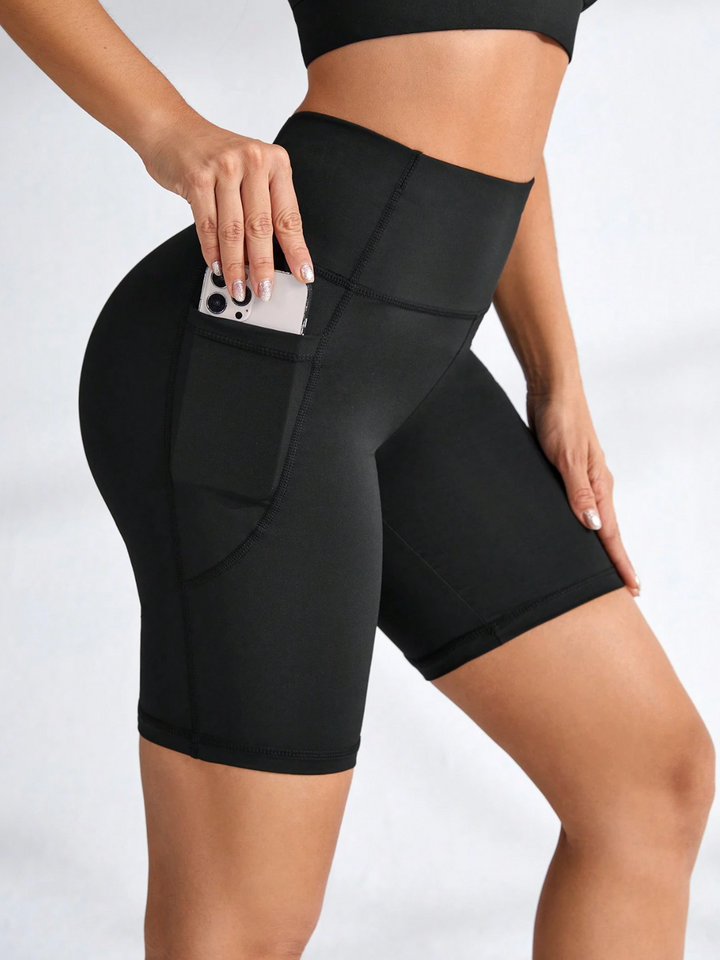 Legging de sport court taille haute avec poches latérales