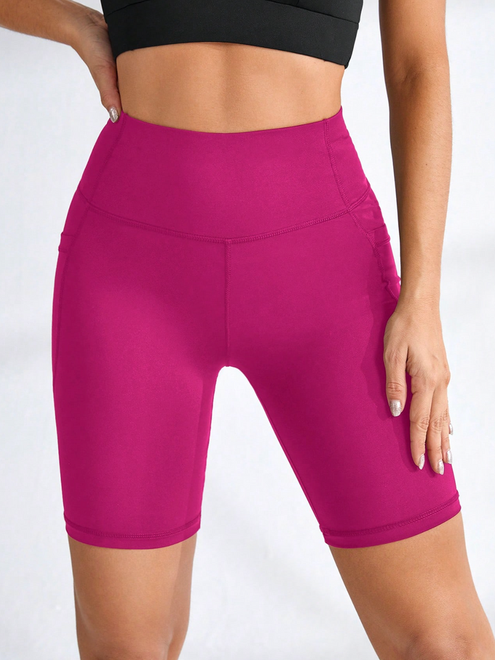 Legging de sport court taille haute avec poches latérales
